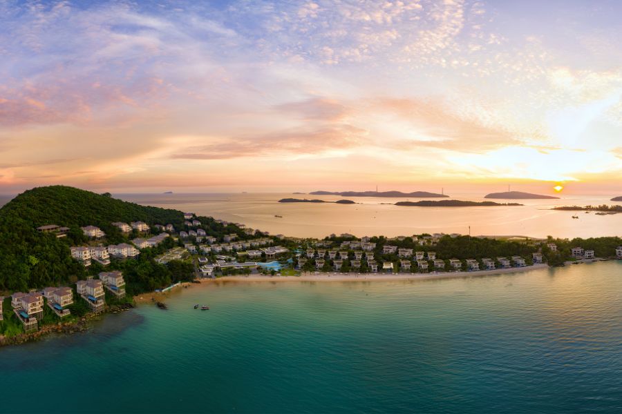 Private beachfront pool villa overlooking the calm turquoise sea on Phu Quoc Island.