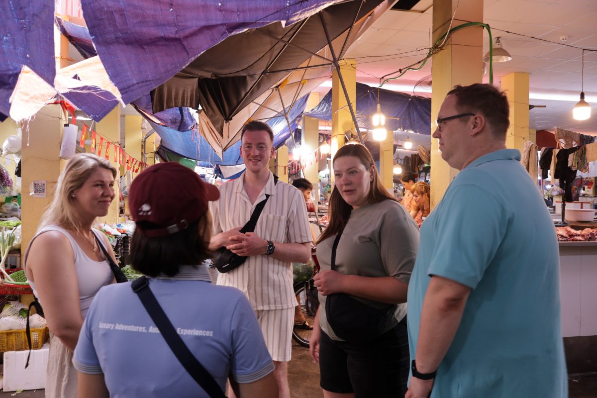 Carefully Listen To Our Local Guide Delivering A Brief On A Vietnam Food Tour