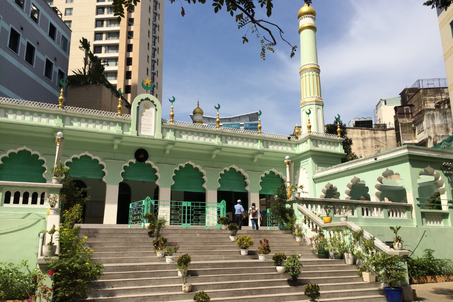 Lush palm-shaded courtyard and arched corridors of Saigon Central Mosque on Dong Du Street in District 1