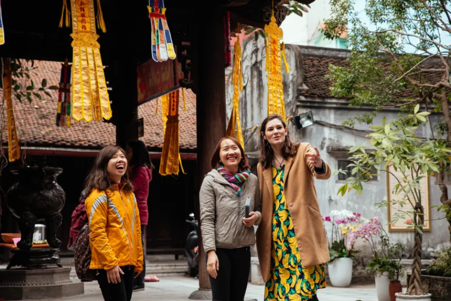 Tourists exploring local culture with an experienced guide after securing their visa to Vietnam