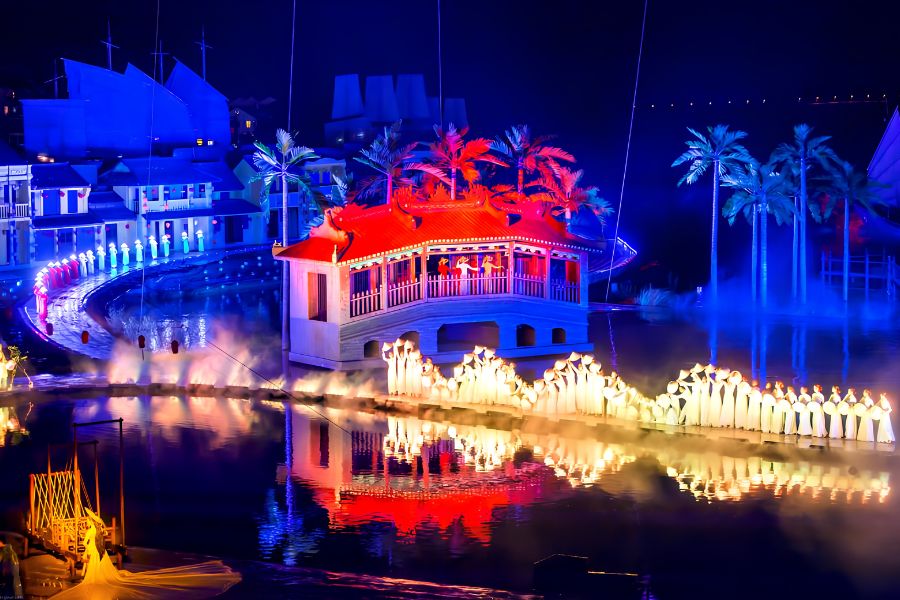 Colourful outdoor performance with lighting and dancers at Hoi An Memories Show
