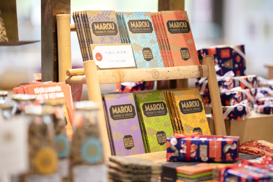 Artisanal single-origin Marou dark chocolate bars wrapped in elegant, gold-stamped silk-screened paper wrappers