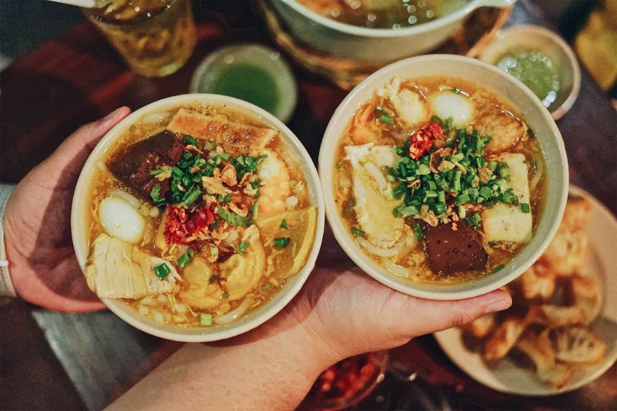 Bowl of banh canh with thick noodles, pork or seafood and savoury broth