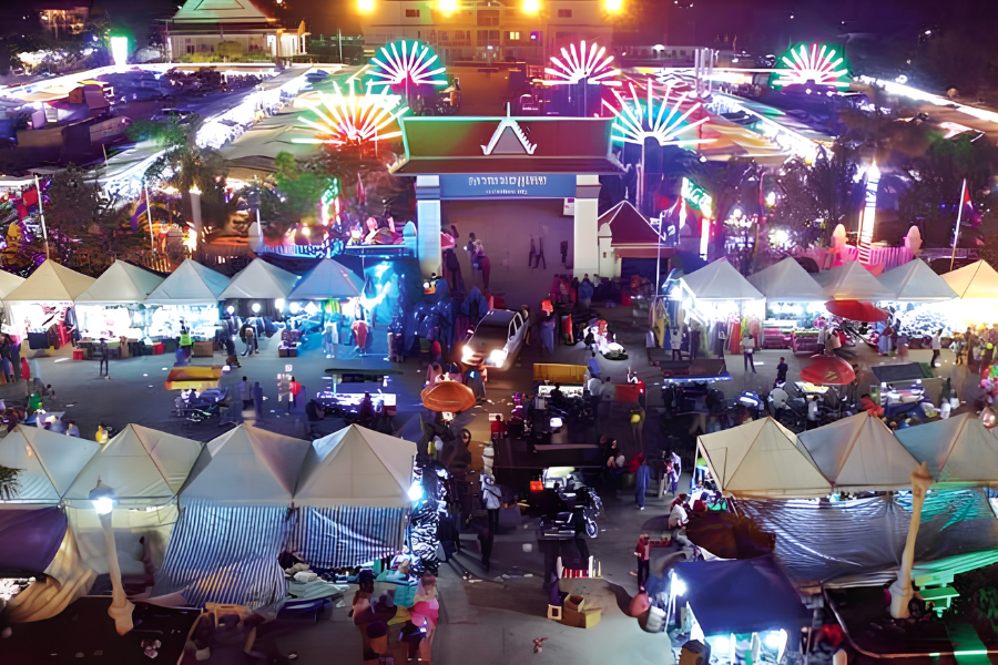Fresh seafood grilling over hot charcoal embers beside the ocean promenade during the coastal Sea Festival in Kep