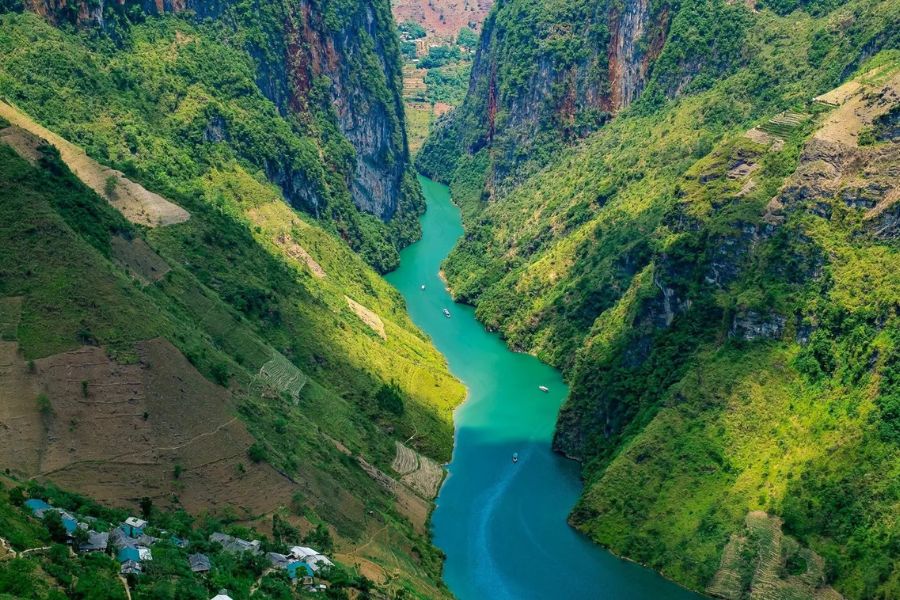 Winding mountain road overlooking Nho Que River near Ma Pi Leng Pass, Ha Giang