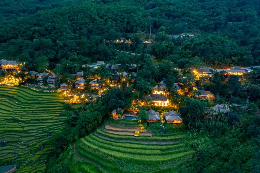 Terraced rice fields and traditional hillside houses in Pu Luong Nature Reserve