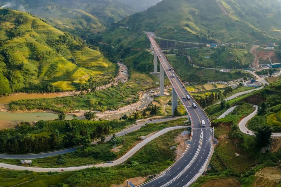 Private vehicle travelling through the mountain landscape on the road to Sapa